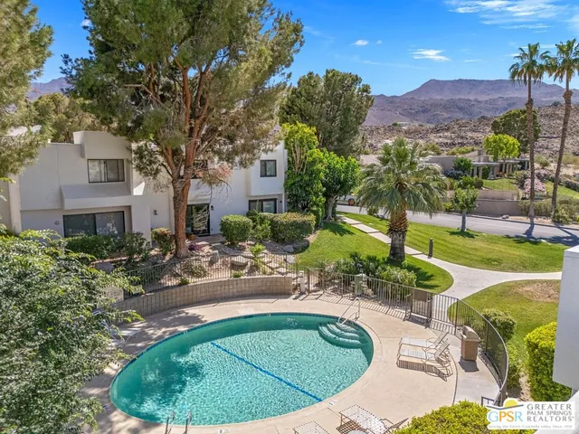 a view of a swimming pool with a patio