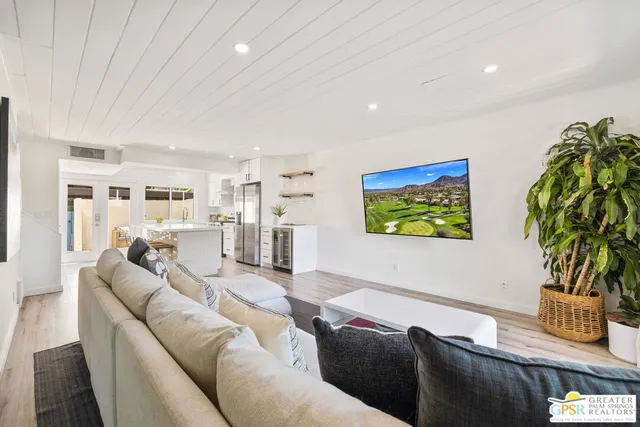 a kitchen with cabinets and wooden floor