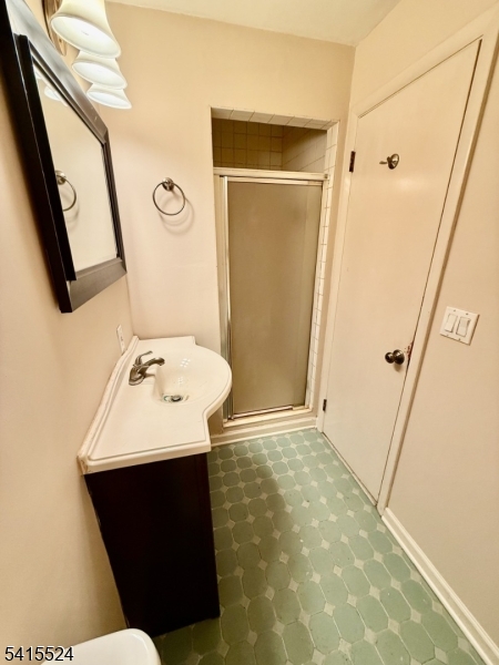 150 Karrville Road Port Murray, NJ 07865 - Photo 14 of 40 a bathroom with a sink a mirror and a vanity