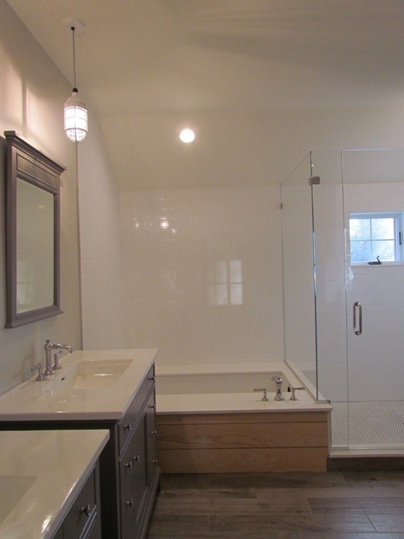135 Maple Street, Unit 135 Needham, MA 02492 - Photo 11 of 13 a bathroom with a sink a toilet and shower
