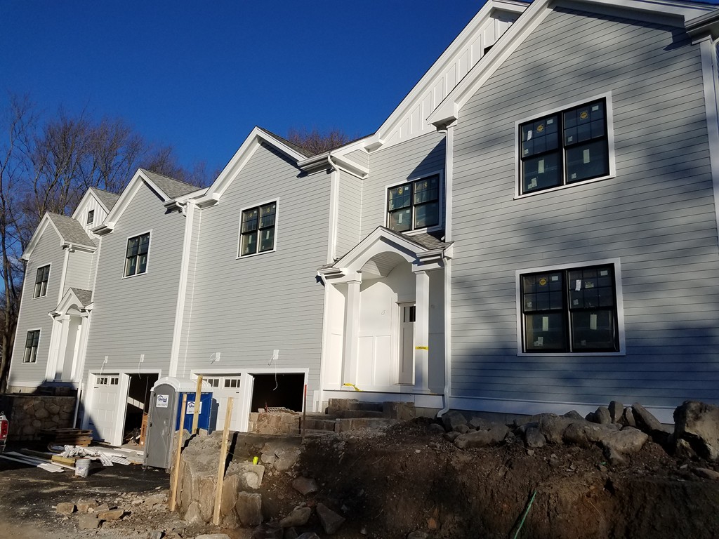 135 Maple Street, Unit 135 Needham, MA 02492 - Photo 13 of 13 a front view of a house with a yard