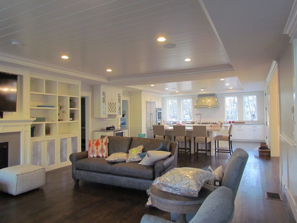 135 Maple Street, Unit 135 Needham, MA 02492 - Photo 3 of 13 a living room with furniture and wooden floor