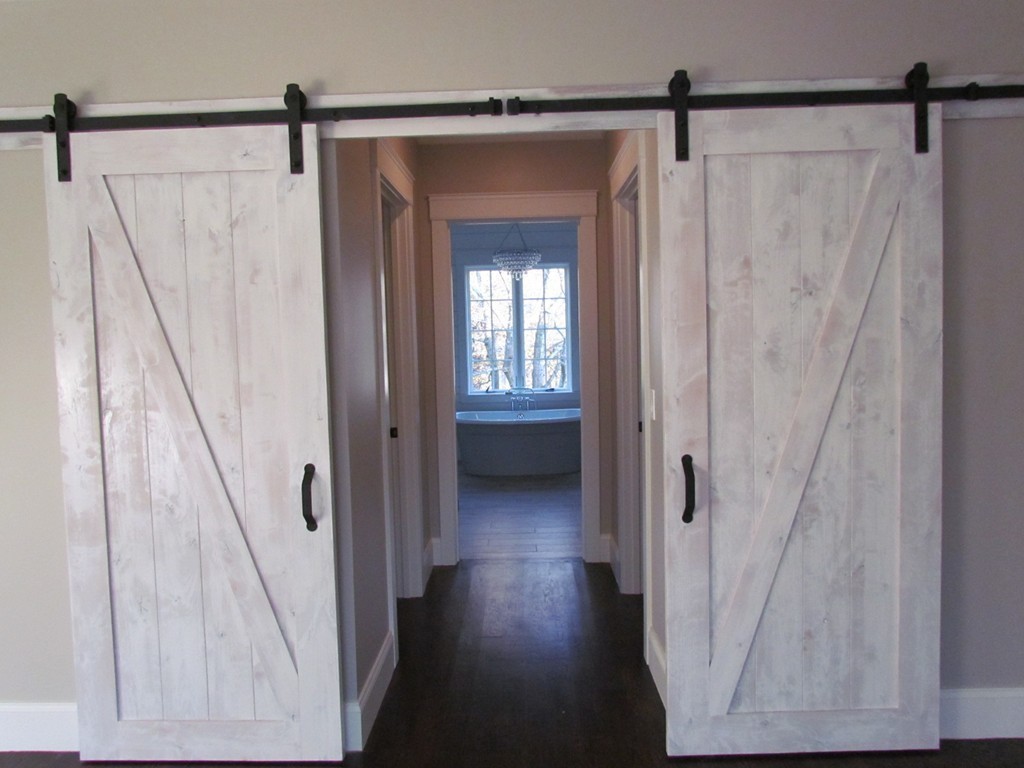 135 Maple Street, Unit 135 Needham, MA 02492 - Photo 8 of 13 a view of a hallway with wooden floor and entryway