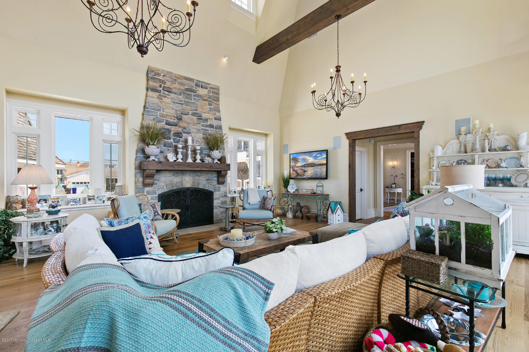 459 Normandy Drive Normandy Beach, NJ 08738 - Photo 30 of 38 a living room with furniture a fireplace and a chandelier