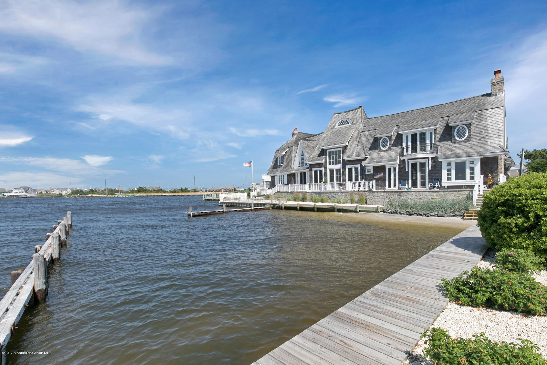 459 Normandy Drive Normandy Beach, NJ 08738 - Photo 37 of 38 a view of building with lake and mountain view
