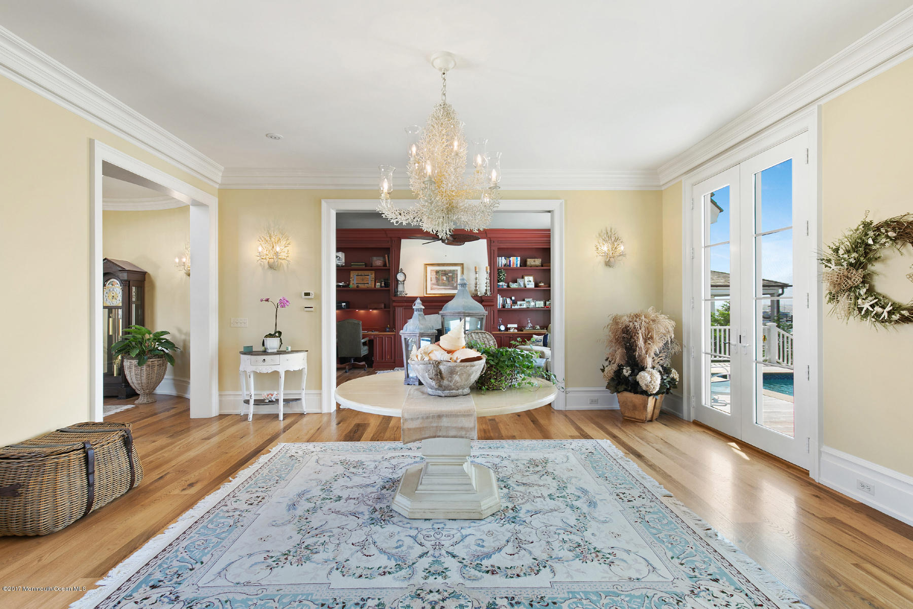 459 Normandy Drive Normandy Beach, NJ 08738 - Photo 7 of 38 a living room with furniture a chandelier and wooden floor