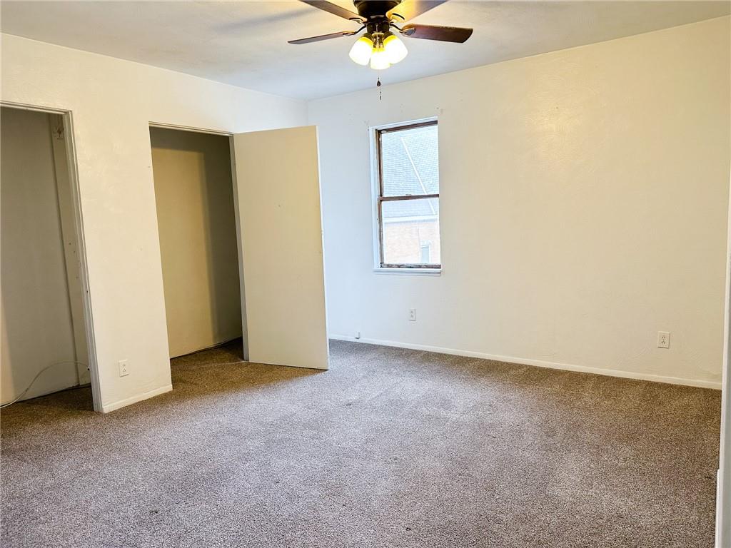 116-118 Rudolph Place Apollo, PA 15613 - Photo 9 of 12 an empty room with windows and fan
