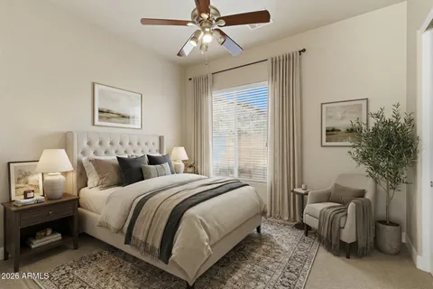 a bedroom with bed and a chandelier