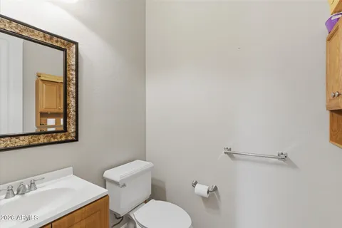 a white toilet sitting next to a bathroom sink