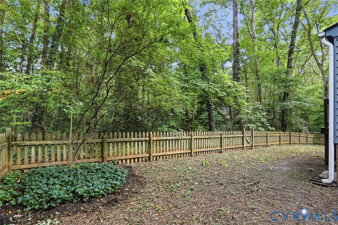 13913 Barnes Spring Road Midlothian, VA 23112 - Photo 42 of 51 Wood picket fencing enclosing a natural landscape