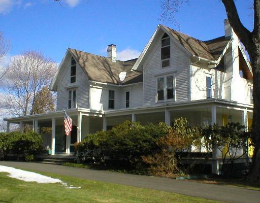 166 Lounsbury Road Ridgefield, CT 06877 - Photo 1 of 1 a front view of a house with a yard