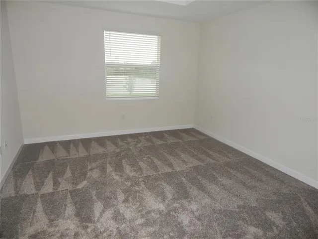 a bathroom with a shower sink and mirror