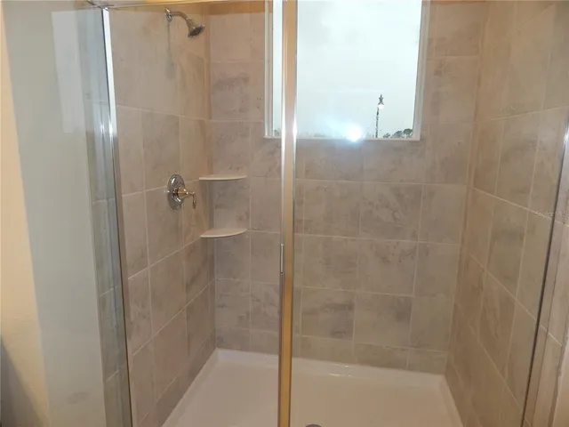 a white toilet sitting next to a white sink