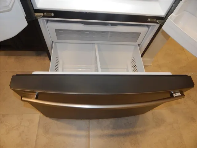 a bathroom with a toilet and a mirror