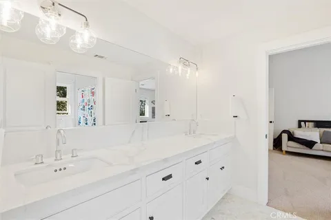 a bedroom with a bed and a table