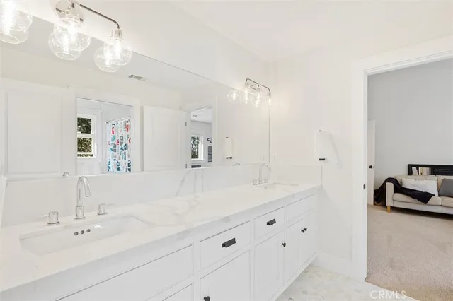 a bedroom with a bed and a table