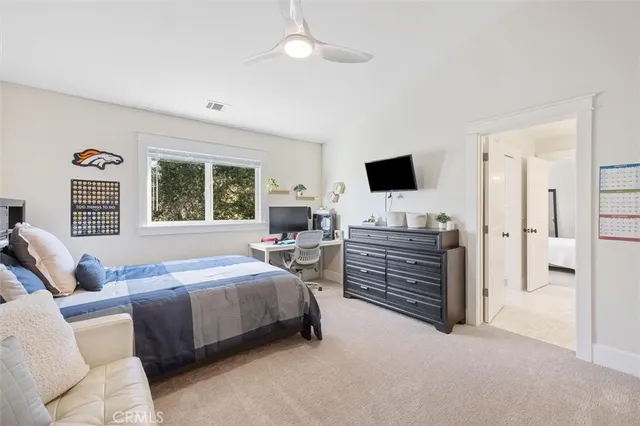 a living room with furniture potted plant and window