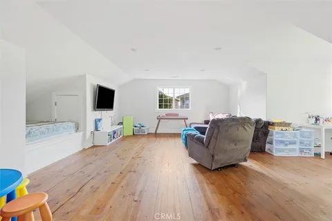 a view of a backyard with a large tree