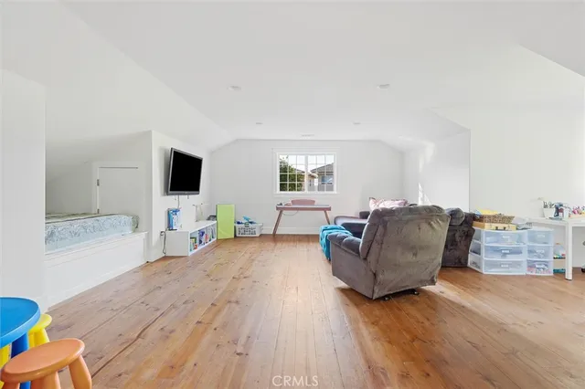 a view of a backyard with a large tree