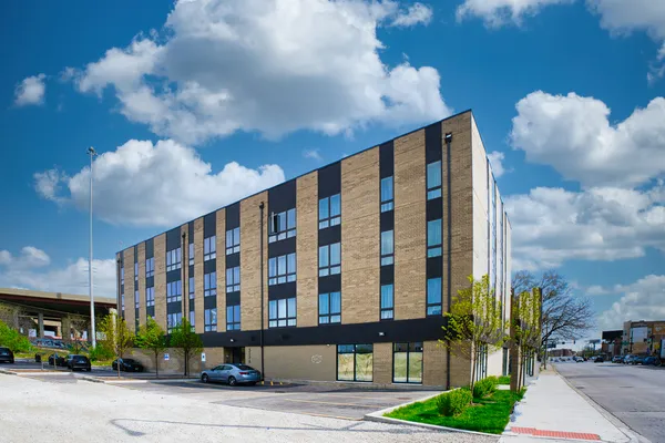 a front view of building with street view