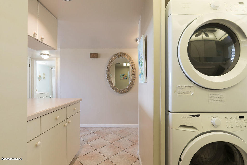 1275 Ocean Shore Boulevard, Unit 108 Ormond Beach, FL 32176 - Photo 12 of 26 a close view of a utility room with dryer and washer