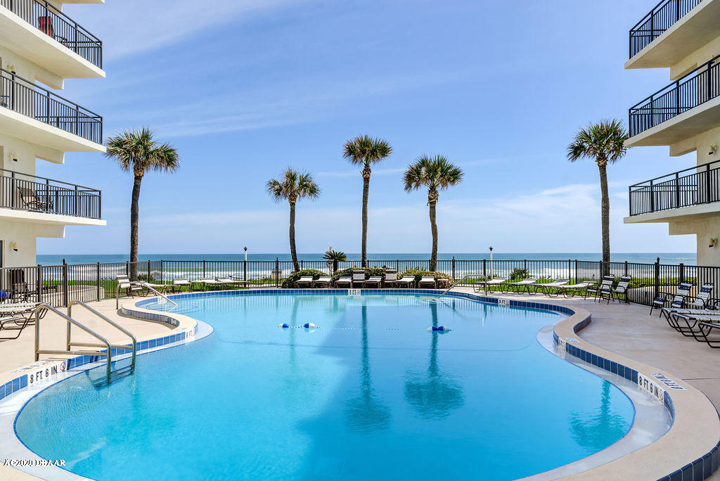 1275 Ocean Shore Boulevard, Unit 108 Ormond Beach, FL 32176 - Photo 21 of 26 a view of a swimming pool with outdoor seating