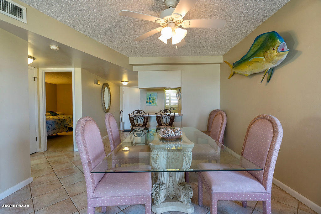 1275 Ocean Shore Boulevard, Unit 108 Ormond Beach, FL 32176 - Photo 6 of 26 a view of a dining room with furniture