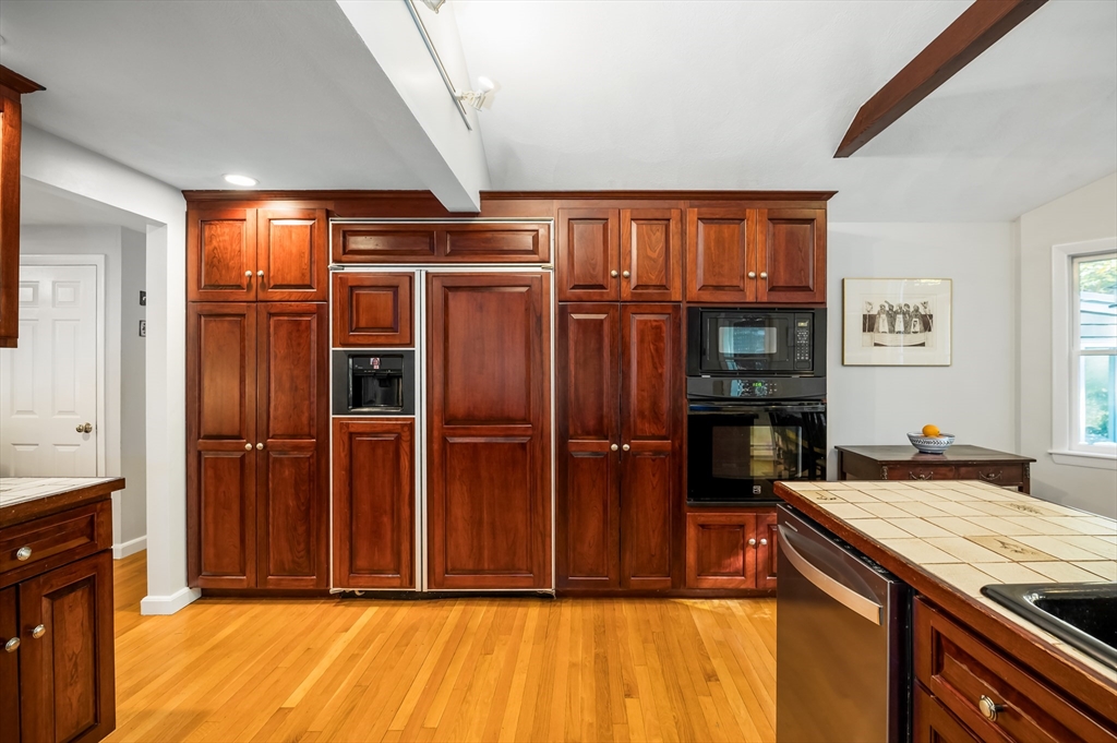 92 Pleasant Street Wenham, MA 01984 - Photo 12 of 33 a kitchen with stainless steel appliances granite countertop a refrigerator and a sink