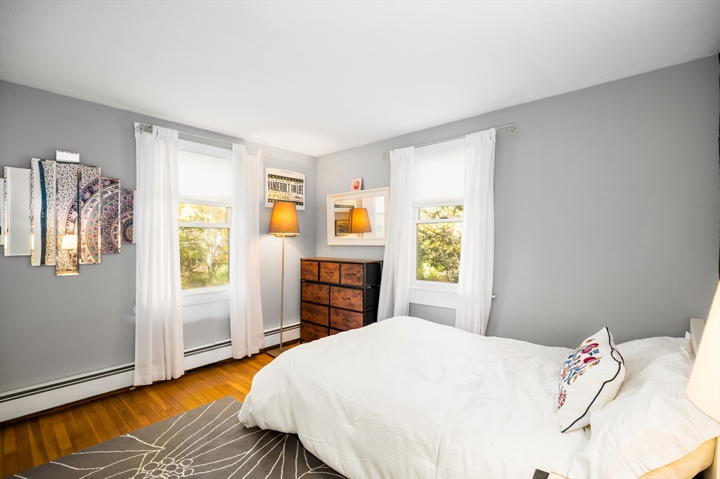 92 Pleasant Street Wenham, MA 01984 - Photo 14 of 33 a bedroom with a bed and a window