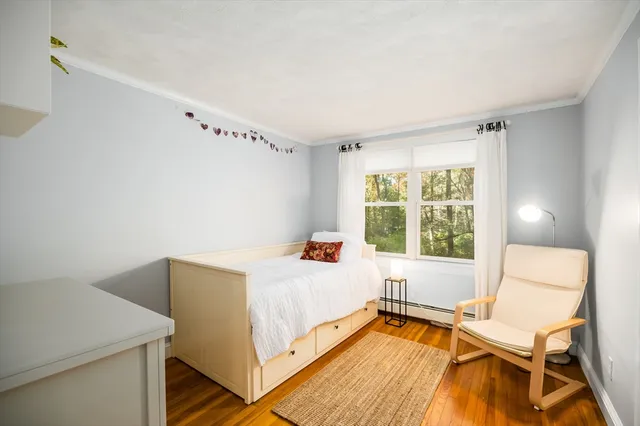 a room with a bed and a window