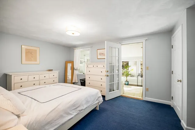 a bedroom with a bed and a cabinets