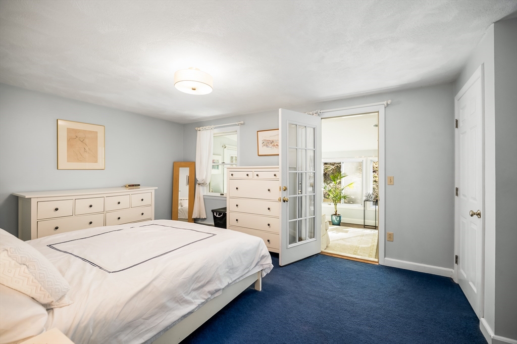 92 Pleasant Street Wenham, MA 01984 - Photo 16 of 33 a bedroom with a bed and a cabinets