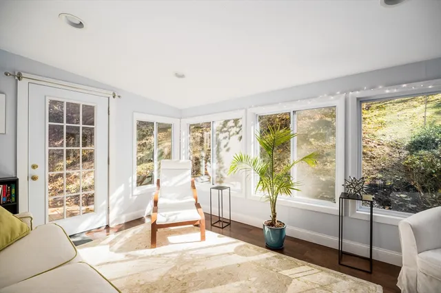 a living room with furniture and windows