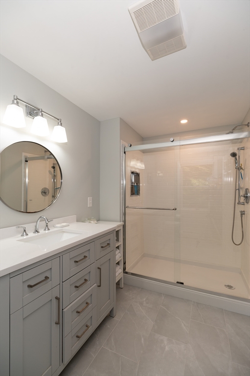 92 Pleasant Street Wenham, MA 01984 - Photo 20 of 33 a bathroom with a double vanity sink and mirror