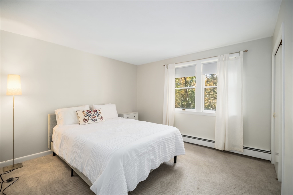 92 Pleasant Street Wenham, MA 01984 - Photo 25 of 33 a bedroom with a bed and a window