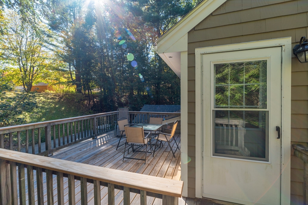 92 Pleasant Street Wenham, MA 01984 - Photo 28 of 33 a view of balcony with furniture and trees