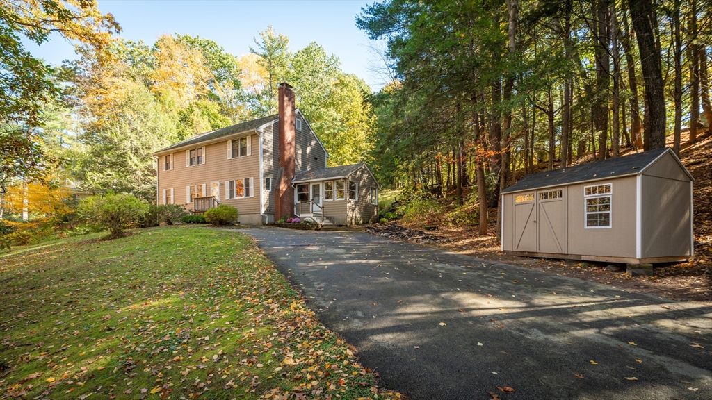 92 Pleasant Street Wenham, MA 01984 - Photo 30 of 33 a view of a house with a yard