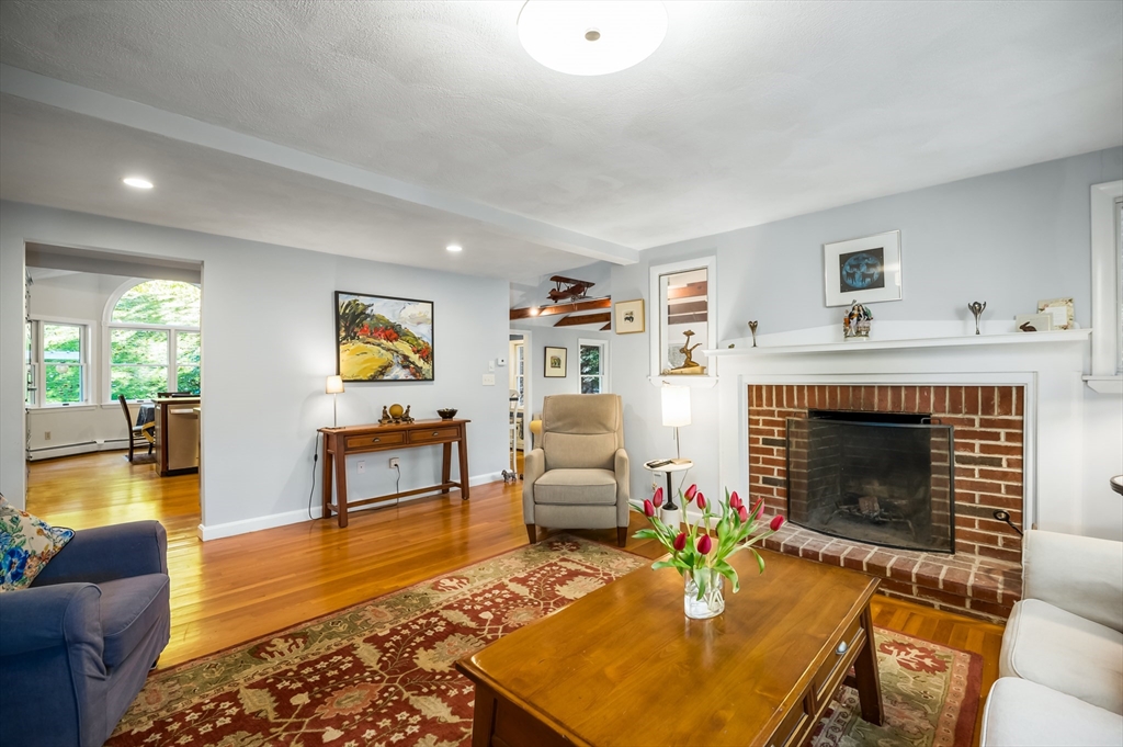92 Pleasant Street Wenham, MA 01984 - Photo 6 of 33 a living room with furniture and a fireplace