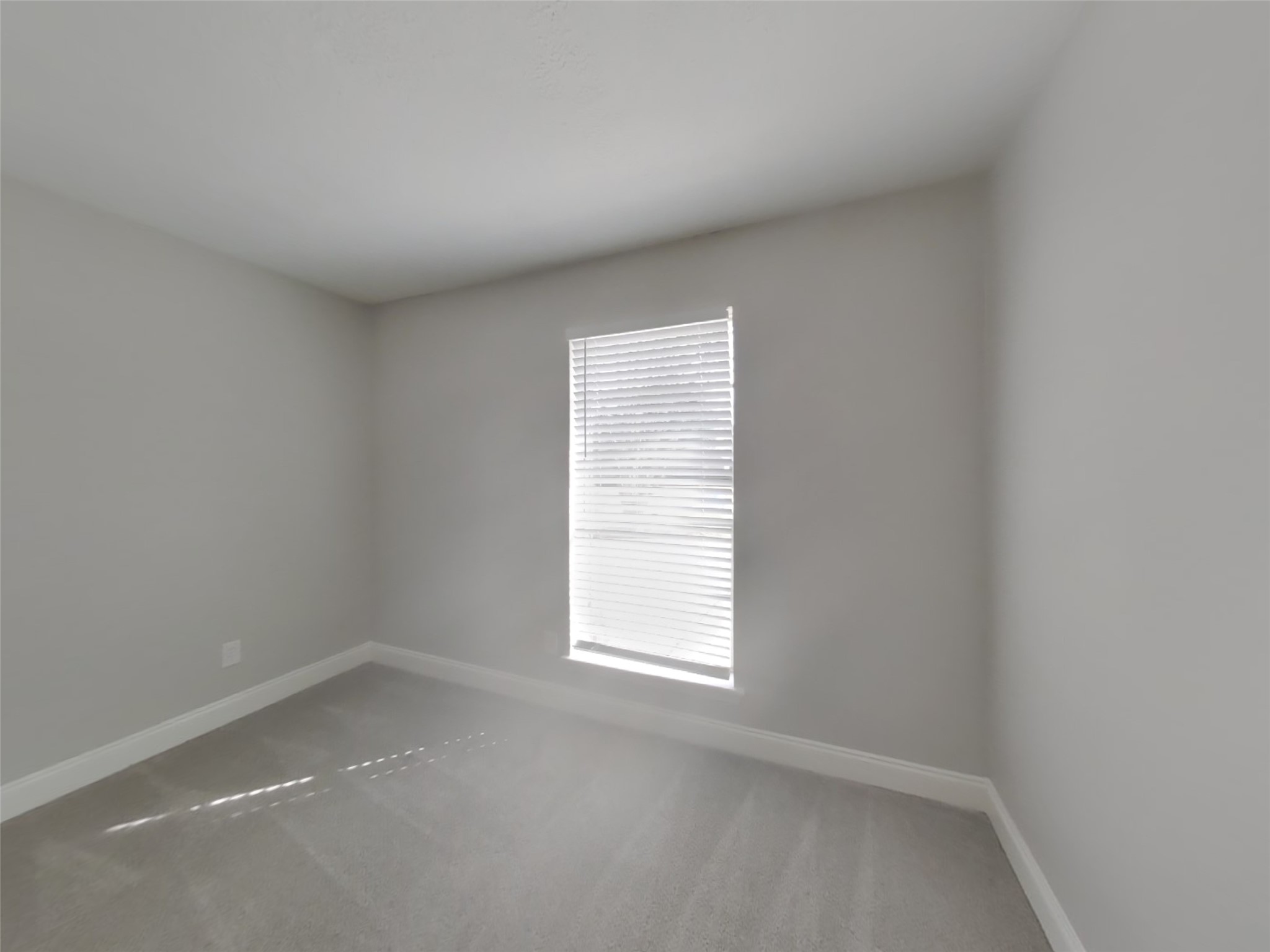 14218 Overbrook Lane Houston, TX 77077 - Photo 12 of 18 an empty room with a window