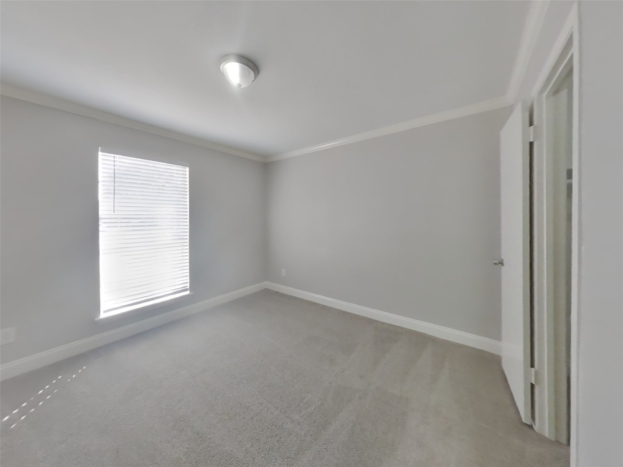 14218 Overbrook Lane Houston, TX 77077 - Photo 15 of 18 an empty room with a window