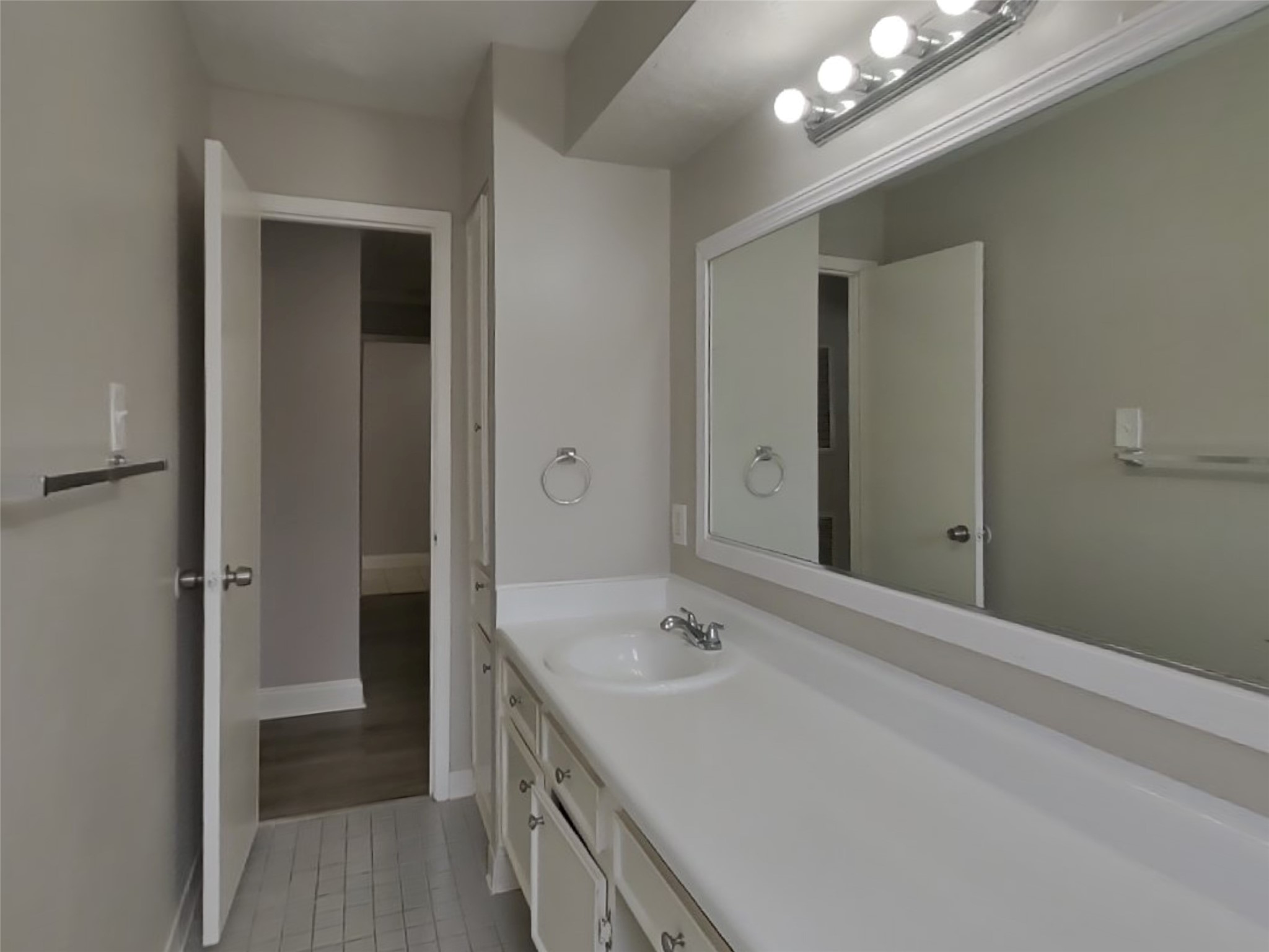14218 Overbrook Lane Houston, TX 77077 - Photo 17 of 18 a bathroom with a sink a large mirror and a shower