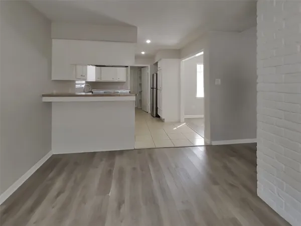 a view of kitchen with wooden floor