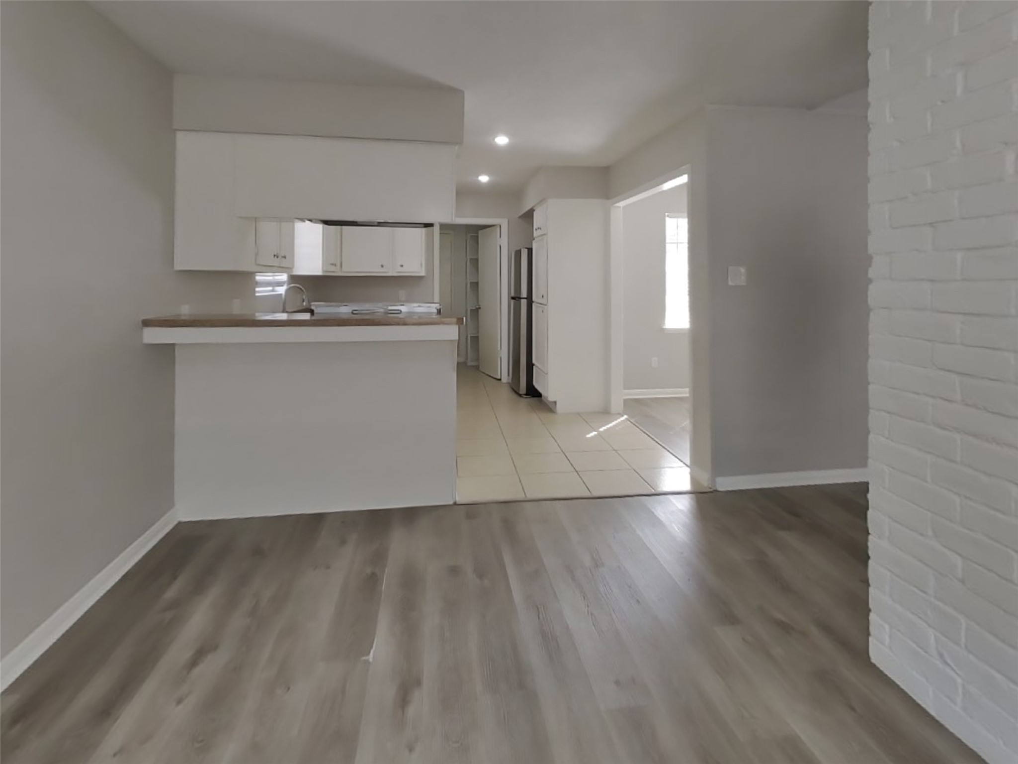 14218 Overbrook Lane Houston, TX 77077 - Photo 5 of 18 a view of kitchen with wooden floor