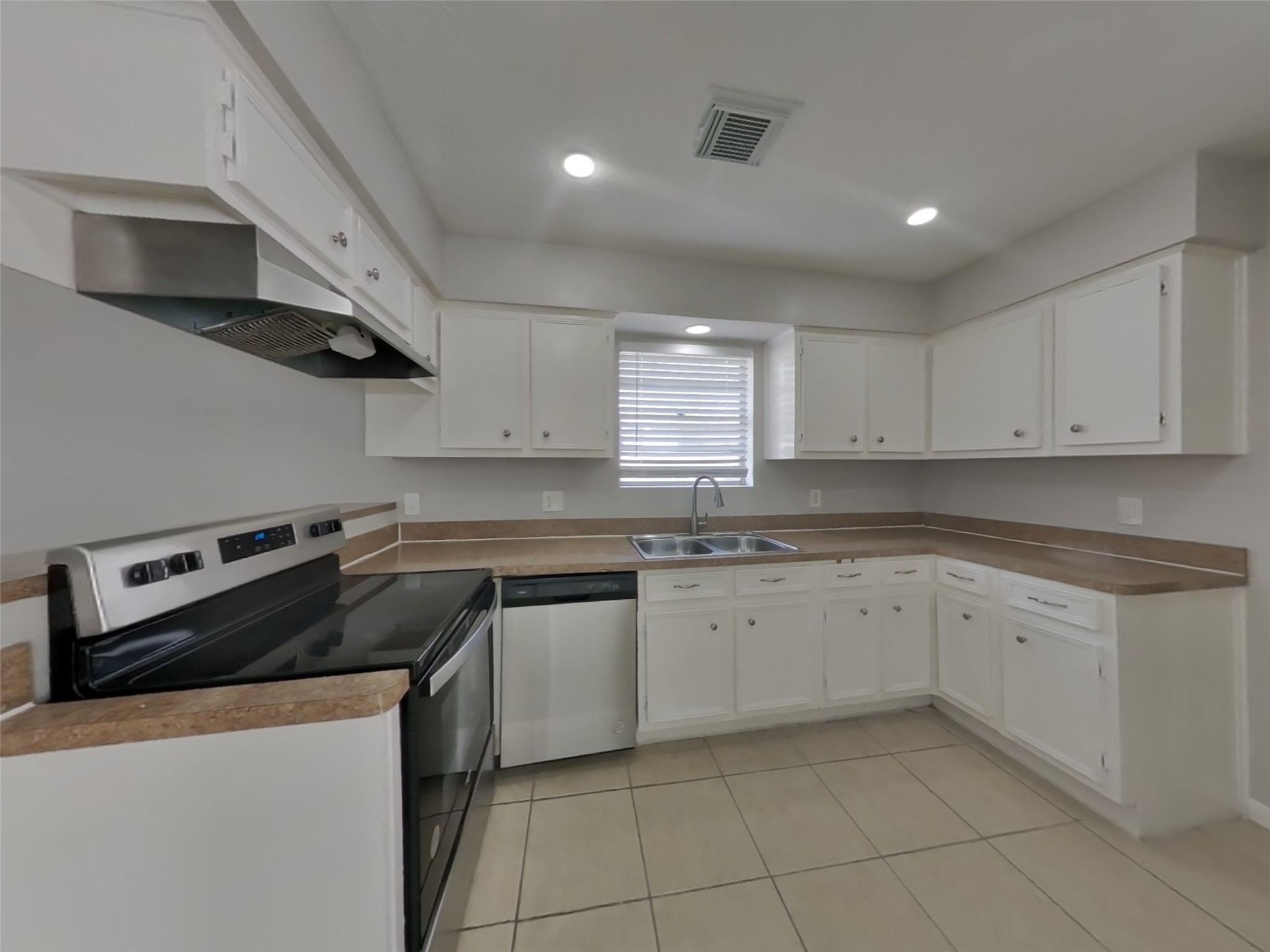 14218 Overbrook Lane Houston, TX 77077 - Photo 6 of 18 a kitchen with stainless steel appliances granite countertop a sink and a stove