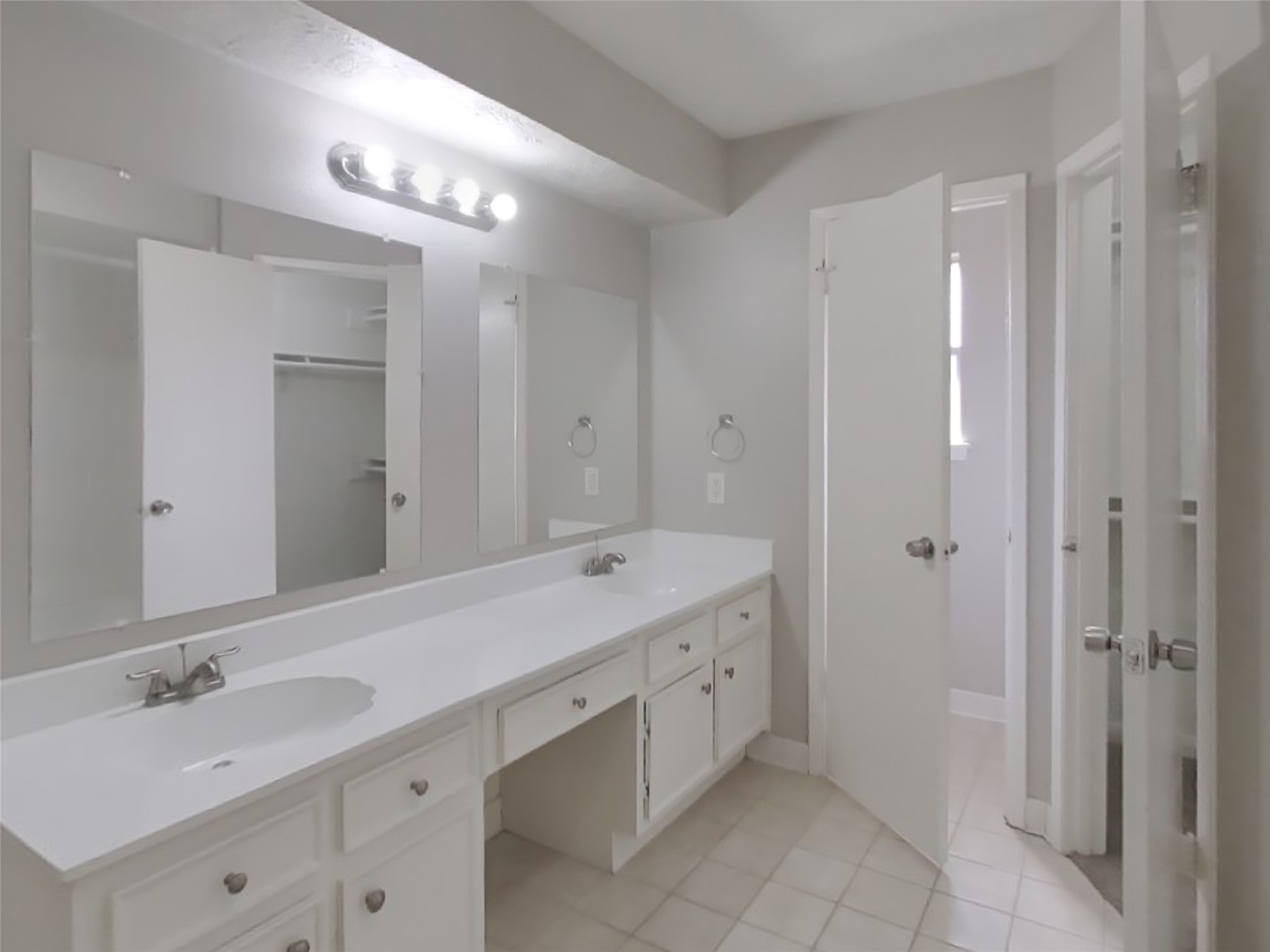 14218 Overbrook Lane Houston, TX 77077 - Photo 10 of 18 a spacious bathroom with a double vanity sink mirror and double