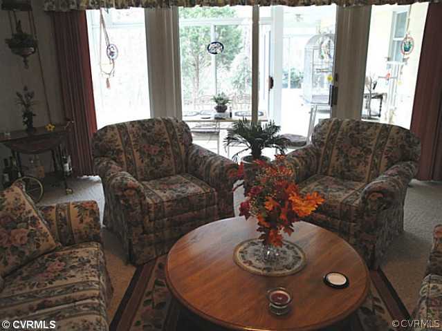 1010 Milby Town Road Shacklefords, VA 23156 - Photo 18 of 24 a living room with furniture and a large window