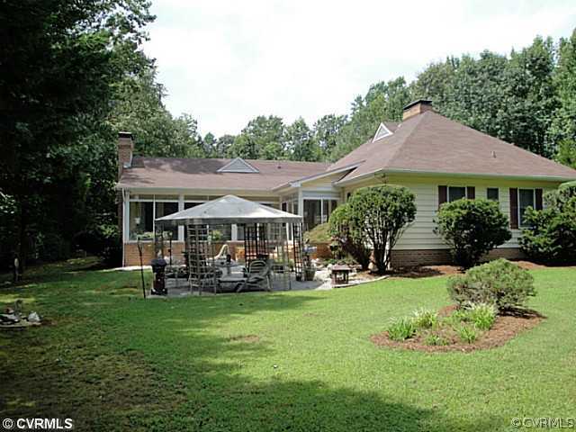1010 Milby Town Road Shacklefords, VA 23156 - Photo 2 of 24 a front view of a house with garden
