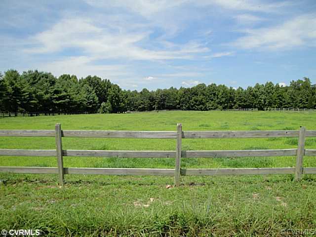 1010 Milby Town Road Shacklefords, VA 23156 - Photo 5 of 24 a view of a golf course with a big yard