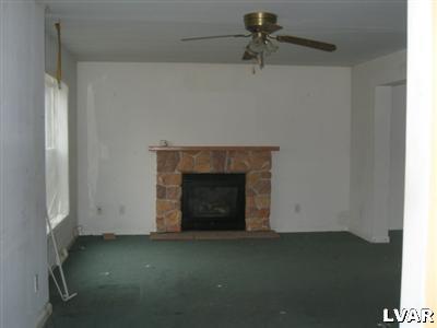 466 English Road Bath, PA 18014 - Photo 3 of 8 a view of empty room with a fireplace