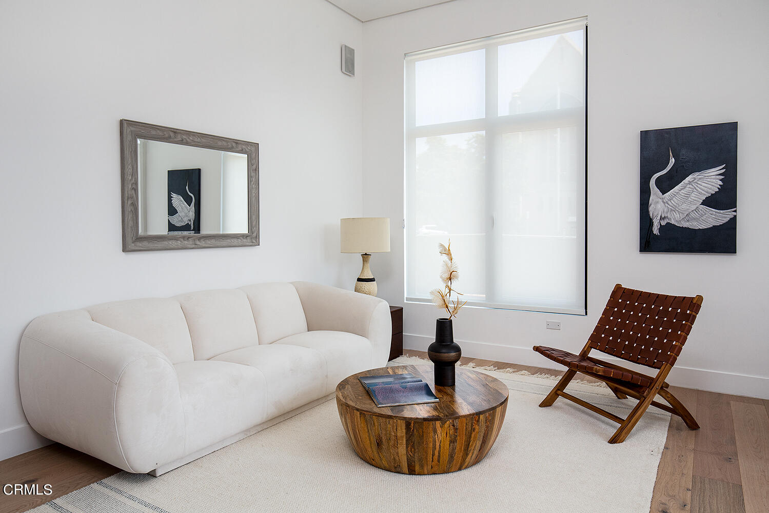 399 East Del Mar Boulevard, Unit 312 Pasadena, CA 91101 - Photo 3 of 7 a living room with furniture and a window